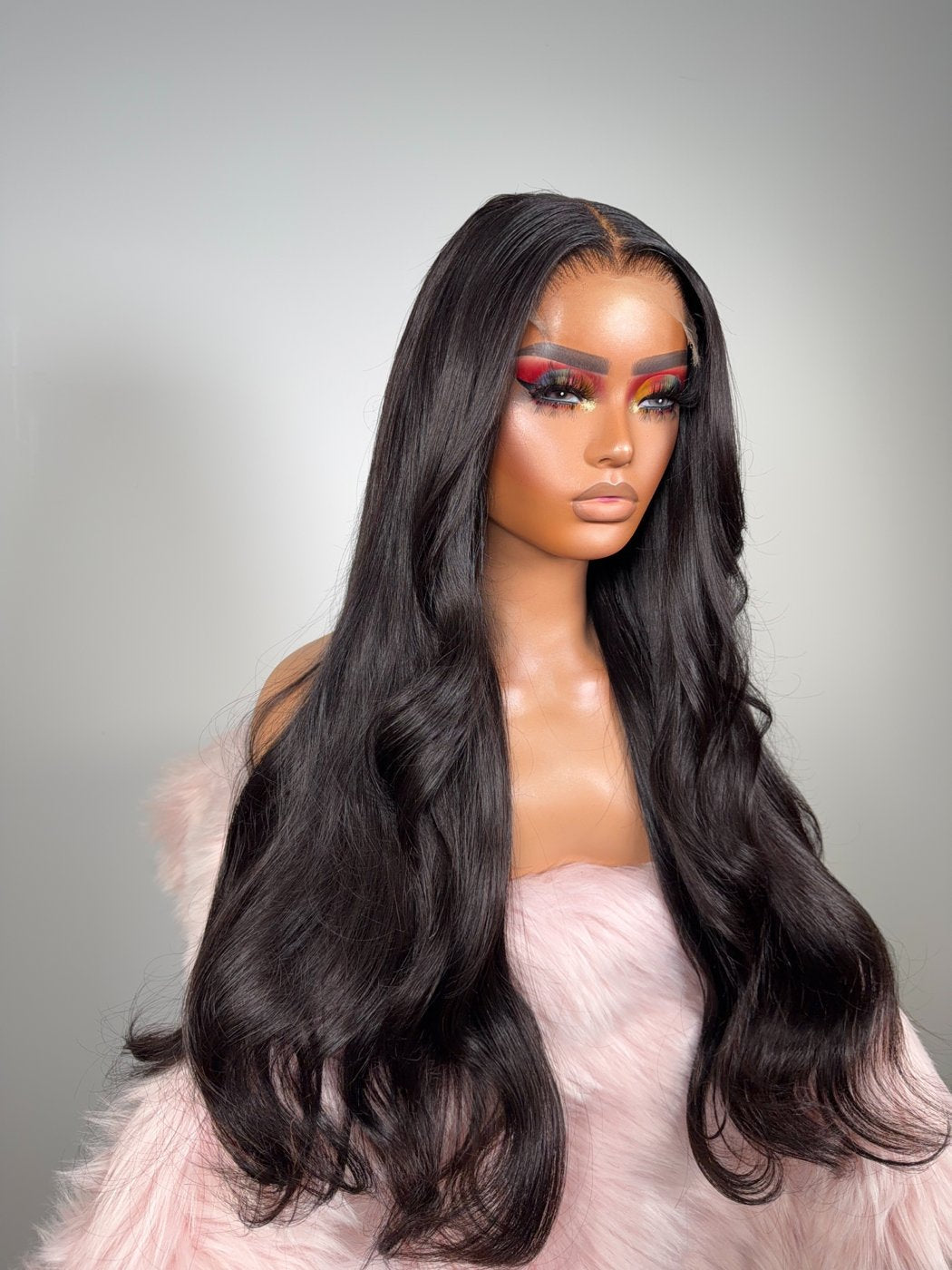 Three-quarter view of the OPHAIR Saraï wig with a soft body wave